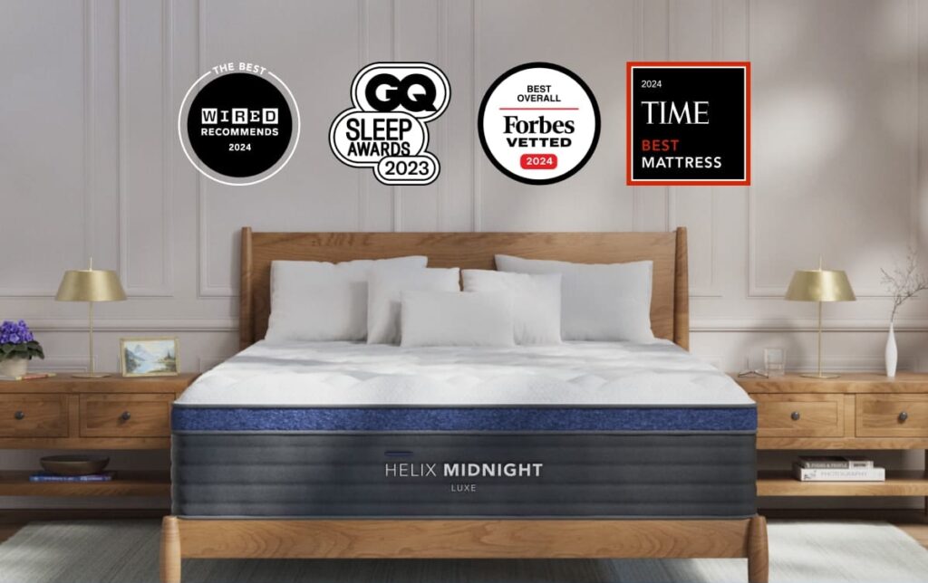 Helix Midnight Luxe mattress on a wooden bed frame with award badges from Wired, GQ, Forbes, and TIME.
