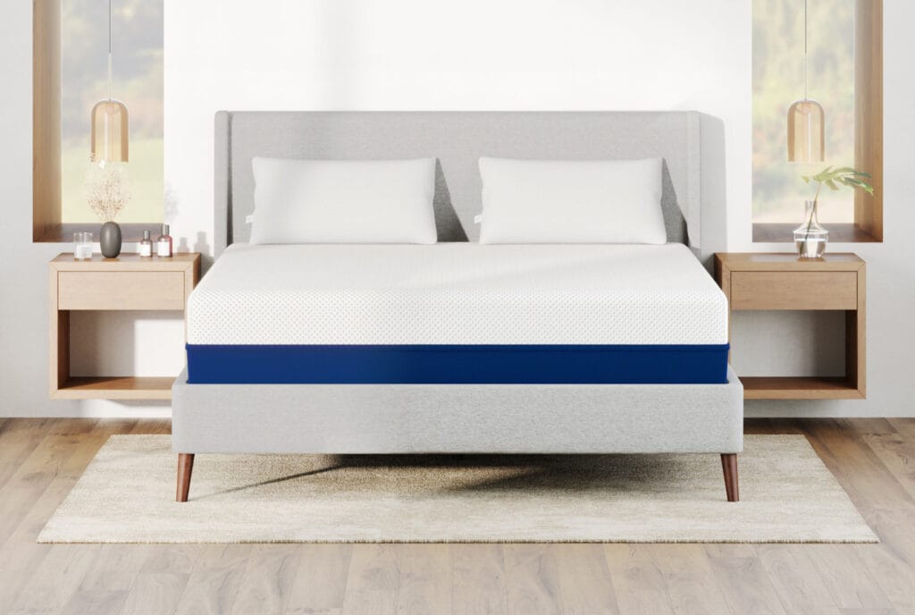 The Amerisleep AS3 medium-firm memory foam mattress with a white comfort layer and navy-blue base.